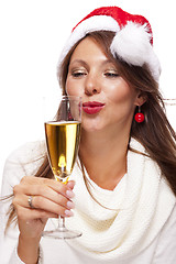 Image showing Playful woman celebrating Xmas blowing a kiss