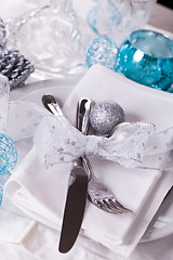 Image showing Stylish blue and silver Christmas table setting