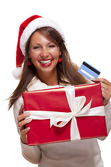 Image showing Woman holding a Christmas gift and bank card