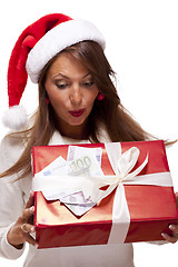 Image showing Young woman with an Xmas gift and money