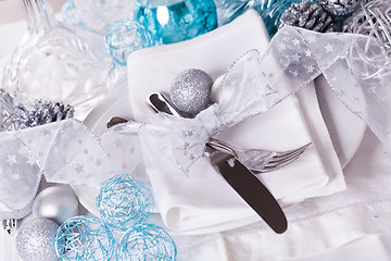 Image showing Stylish blue and silver Christmas table setting