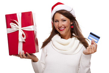 Image showing Woman holding a Christmas gift and bank card