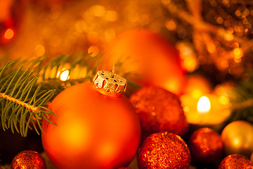 Image showing Warm gold and red Christmas candlelight background