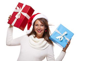 Image showing Vivacious woman in a Santa hat celebrating Xmas