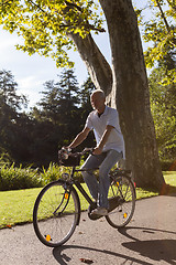 Image showing Senior Man Riding Bicycle
