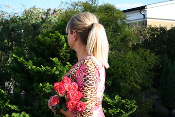 Image showing Swedish woman and pink Roses