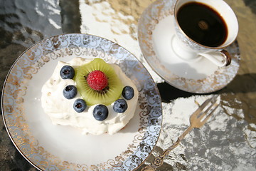 Image showing Piece of gateau with kiwi, raspberry and blueberry