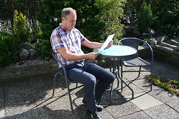 Image showing Swedish man is reading letter