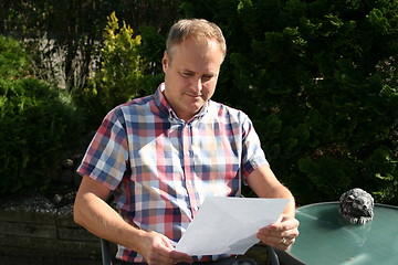 Image showing Swedish man is reading letter