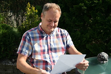 Image showing Swedish man is reading letter