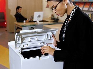 Image showing businesswoman using copy machine