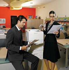 Image showing workers using copy machine iol