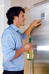 Image showing Man near fridge