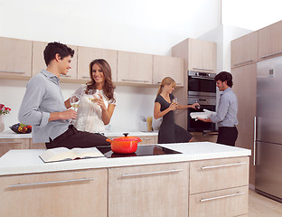 Image showing friends preparing pasta and cooking spaghetti