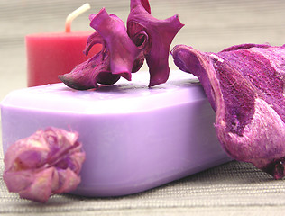 Image showing Lilac soap with decoration articles on a  gray  background