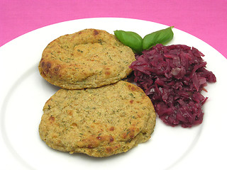 Image showing Round flat potato dough cakes with basil and red cabbage