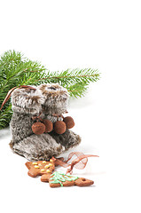 Image showing Fur boots, christmas tree and ginger cookies