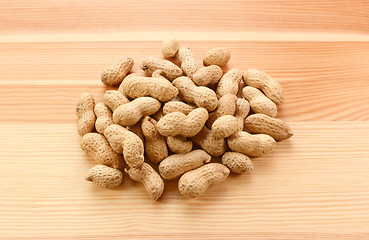 Image showing Heap of monkey nuts, peanuts or groundnuts in shells