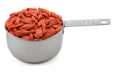 Image showing Red goji berries in a cup measure