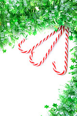 Image showing Green tinsel with candy canes decoration