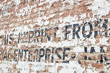 Image showing Old Weathered Brick Wall with Advertisement