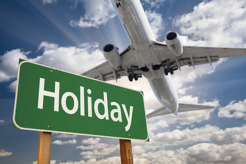 Image showing Holiday Green Road Sign and Airplane Above