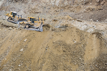 Image showing Excavator Tractors Moving Dirt