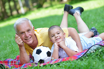 Image showing happy grandfather and child in park