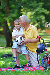 Image showing happy grandfather and child in park