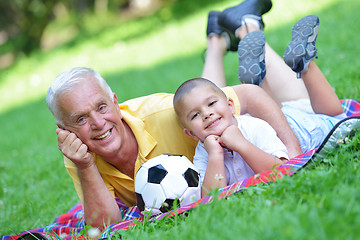 Image showing happy grandfather and child in park