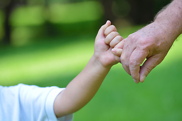 Image showing happy grandfather and child in park