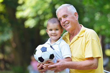 Image showing happy grandfather and child in park