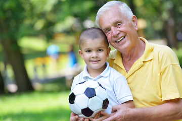 Image showing happy grandfather and child in park