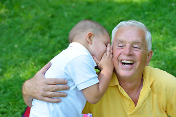 Image showing happy grandfather and child in park