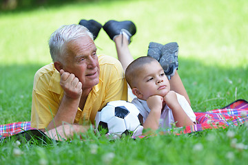 Image showing happy grandfather and child in park