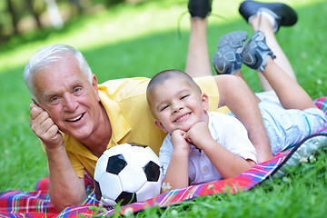 Image showing happy grandfather and child in park