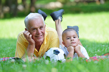 Image showing happy grandfather and child in park