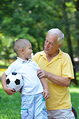 Image showing happy grandfather and child in park