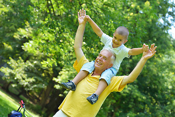 Image showing happy grandfather and child in park