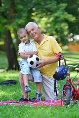 Image showing happy grandfather and child in park