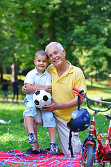 Image showing happy grandfather and child in park