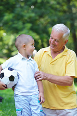 Image showing happy grandfather and child in park