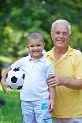 Image showing happy grandfather and child in park