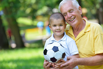 Image showing happy grandfather and child in park