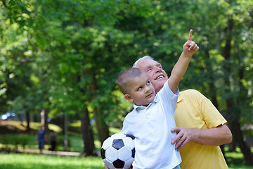 Image showing happy grandfather and child in park