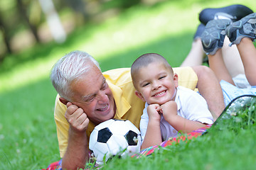 Image showing happy grandfather and child in park