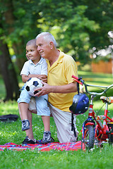 Image showing happy grandfather and child in park