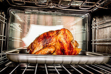 Image showing Roast chicken in the oven.