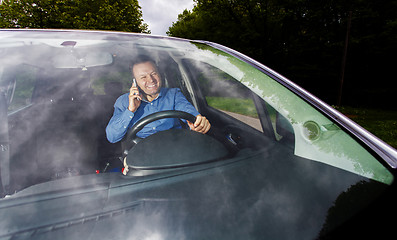 Image showing Driver and cellphone