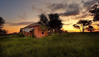 Image showing Abandoned farm house at sunset